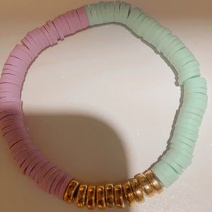 I’m selling a blue and purple clay bead bracelet